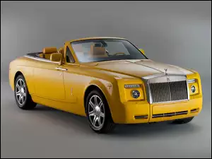 Żółty samochód Rolls Royce Phantom Drophead coupe