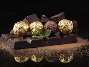 Okrągłe pralinki na tabliczce czekolady