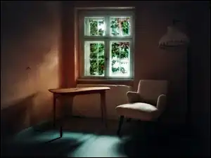 Stolik z fotelem przy oknie