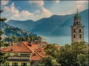 Chmury, Góry, Dachy, Szwajcaria, Lugano, Jezioro Lugano, Drzewa, Domy, Alpy Szwajcarskie, Wieża, Katedra św. Wawrzyńca, Kanton Ticino